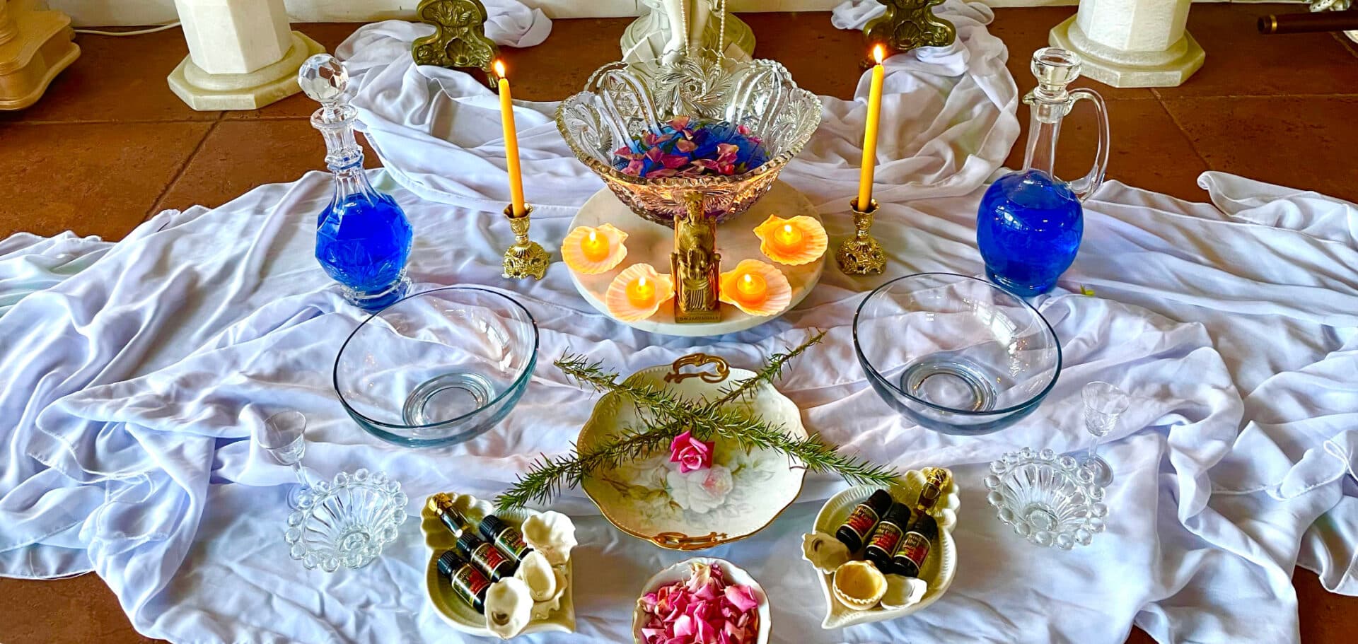 A softly lit temple space dressed for ceremony