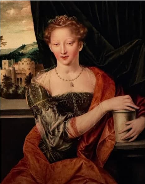 A Northern Renaissance portrait of Mary Magdalene in a russet mantle, holding her jar of ointment before a castle landscape