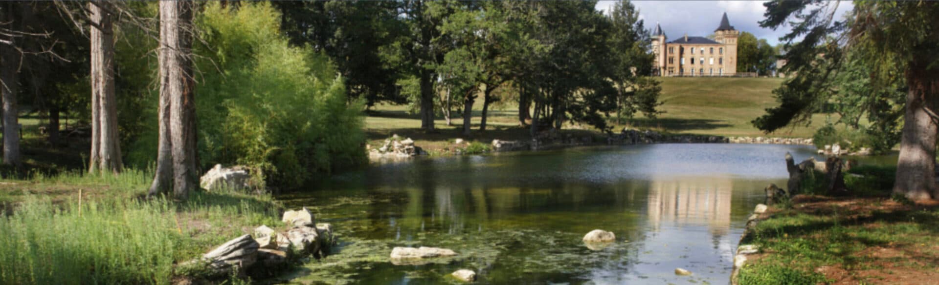 The lake and grounds of the chateau in Occitania