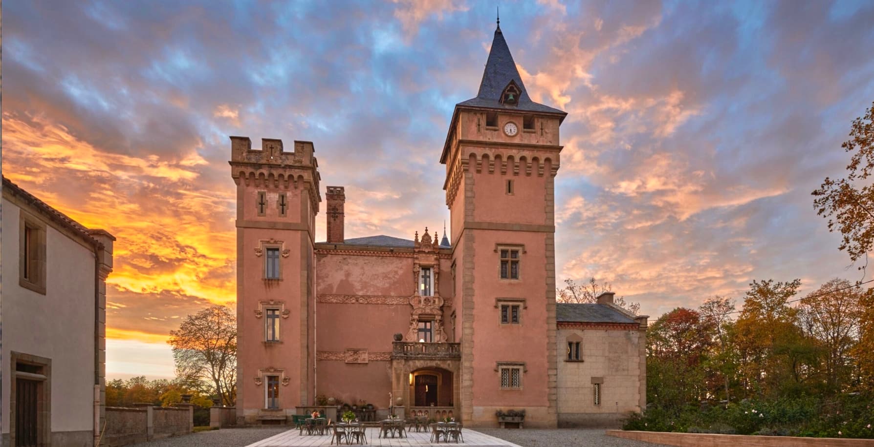 The pink castle at sunset, towers against a golden sky