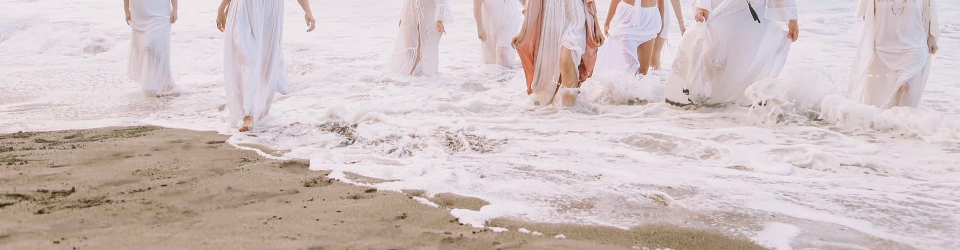 Women walking into the sea